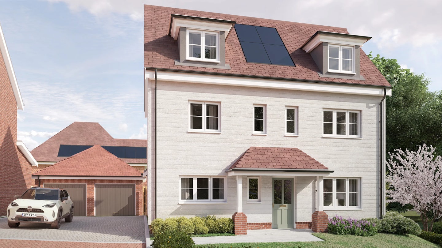 CGI of a modern two-story house with red roof tiles and a light-colored exterior, featuring an attic with two dormer windows and solar panels installed on the roof. The front façade includes a green front door, multiple windows, and a small covered porch. A paved driveway leads to an attached garage, with a white car parked outside. Surrounding the home are lush bushes, a flowering tree, and a well-maintained garden, while a neighboring building with solar panels hints at a sustainability-conscious community