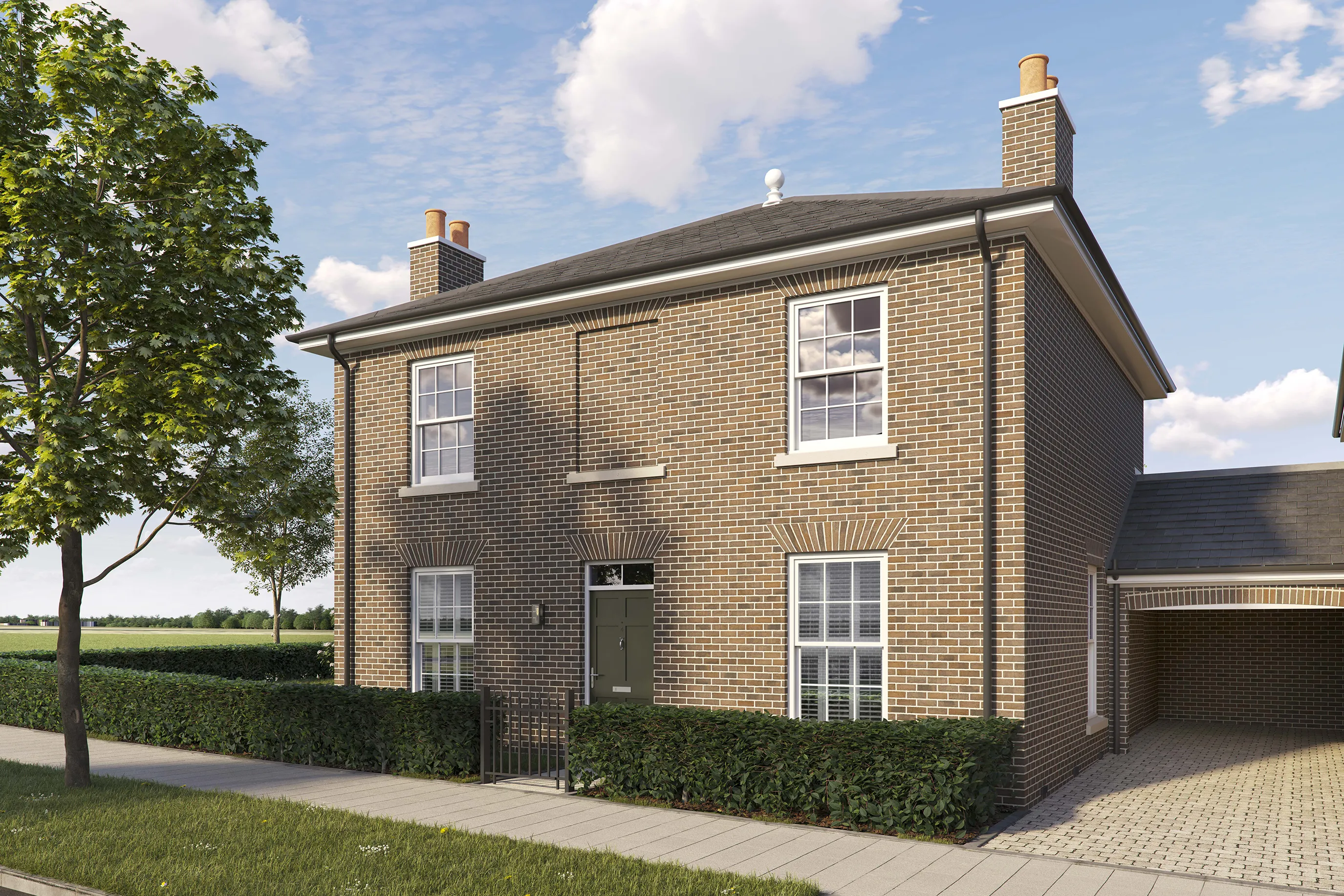 Two-story detached brick house with a pitched roof and white-framed sash windows. The front features a dark green door with a small canopy and two large windows on the ground floor, plus two similar windows above. A low hedge runs along the front of the property, and a paved sidewalk borders the street. A tree is planted on the grass verge to the left, and open fields are visible in the background under a bright blue sky with scattered clouds.