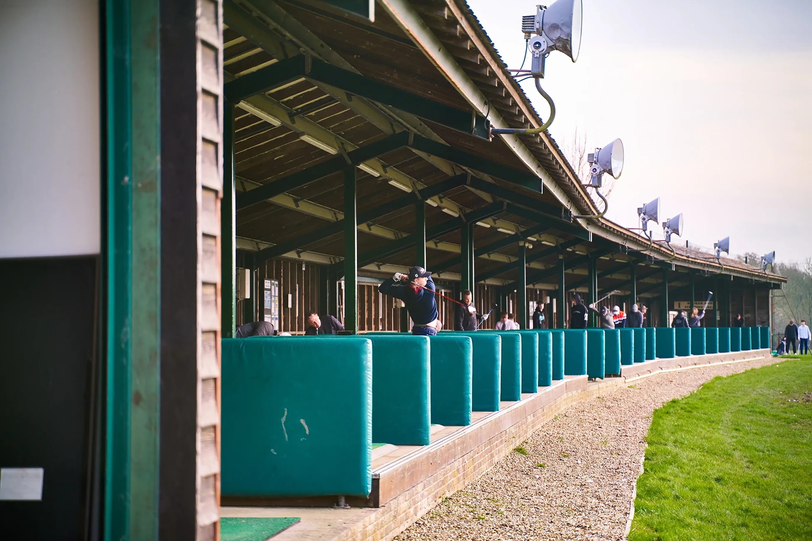 a photo showing Burgess hill golf club, the photo shows a golfer at the driving range