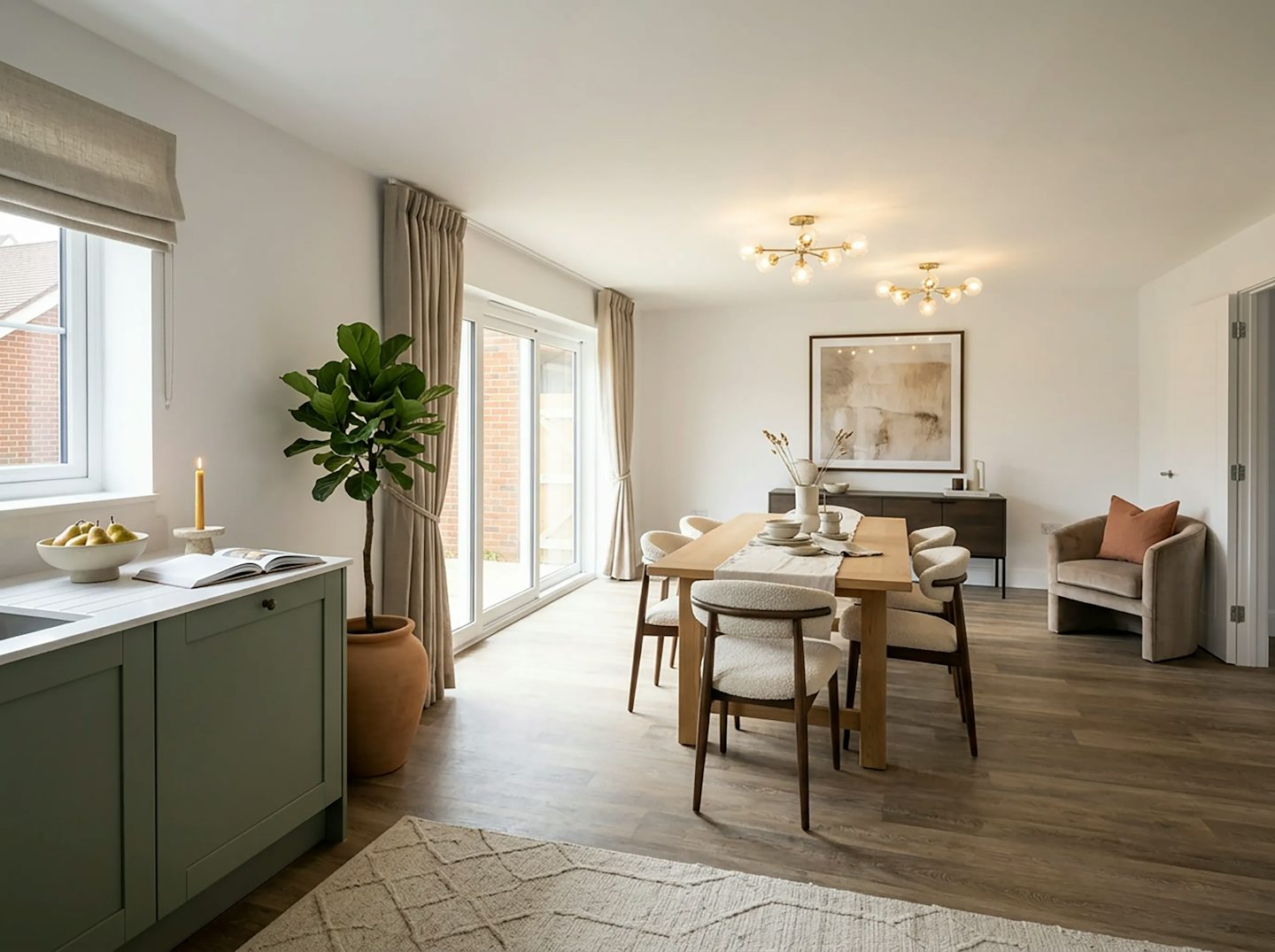Open-plan kitchen and dining area with patio doors leading to the garden.