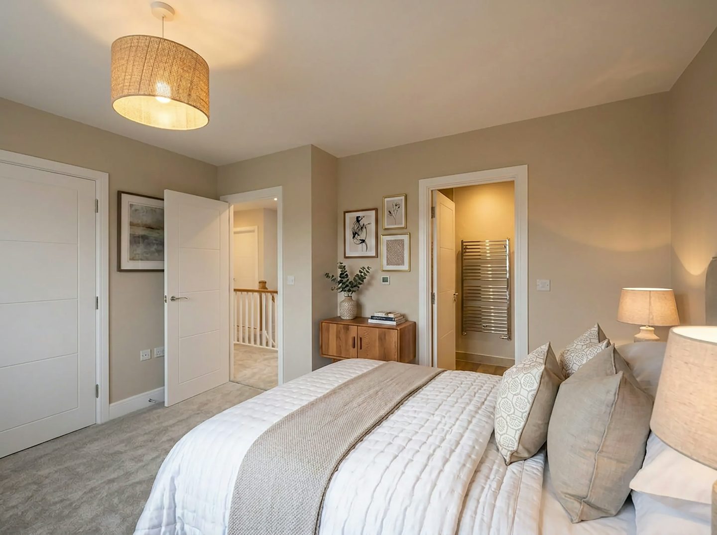 Main bedroom with double bed, bedside tables and fitted wardrobe.