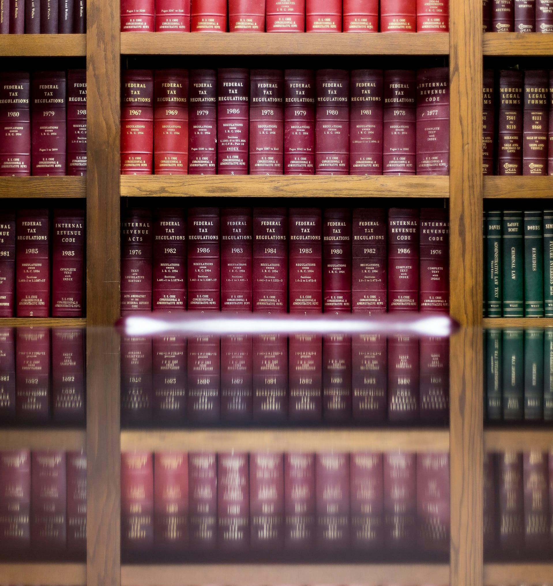 Photo of a library of legal books.