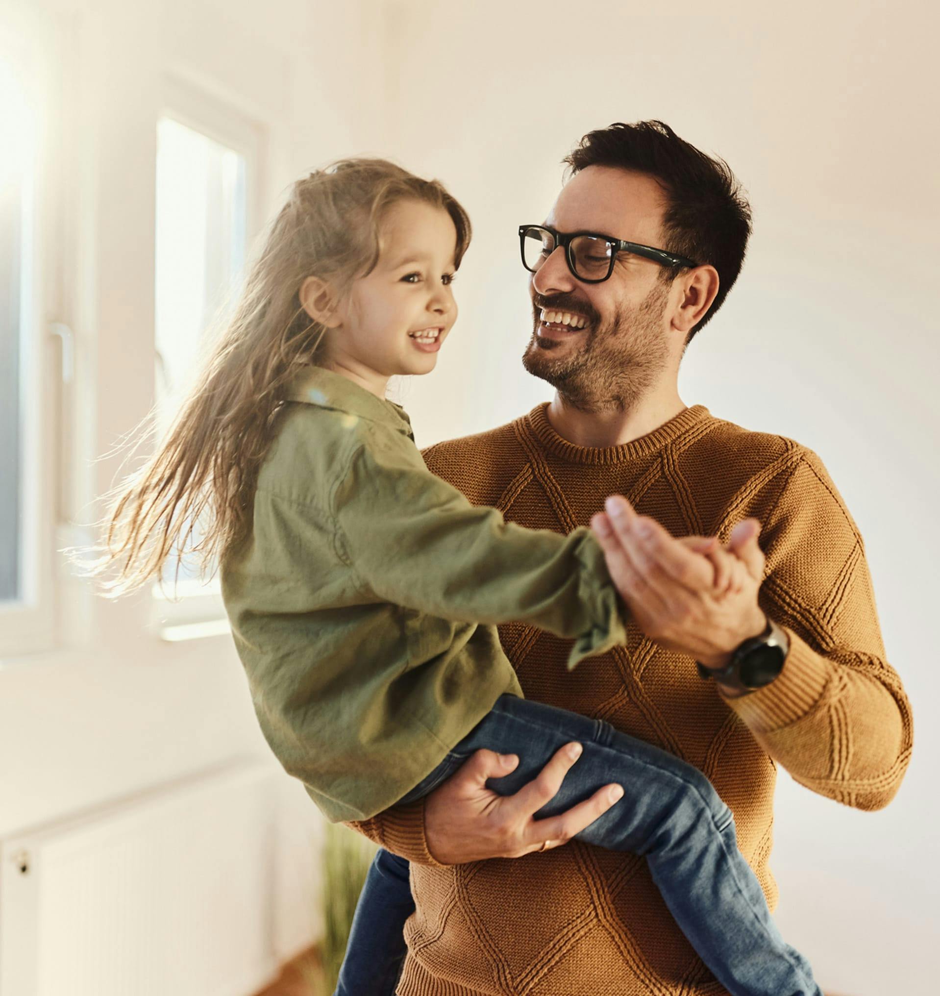 Happy father playing with his kid.