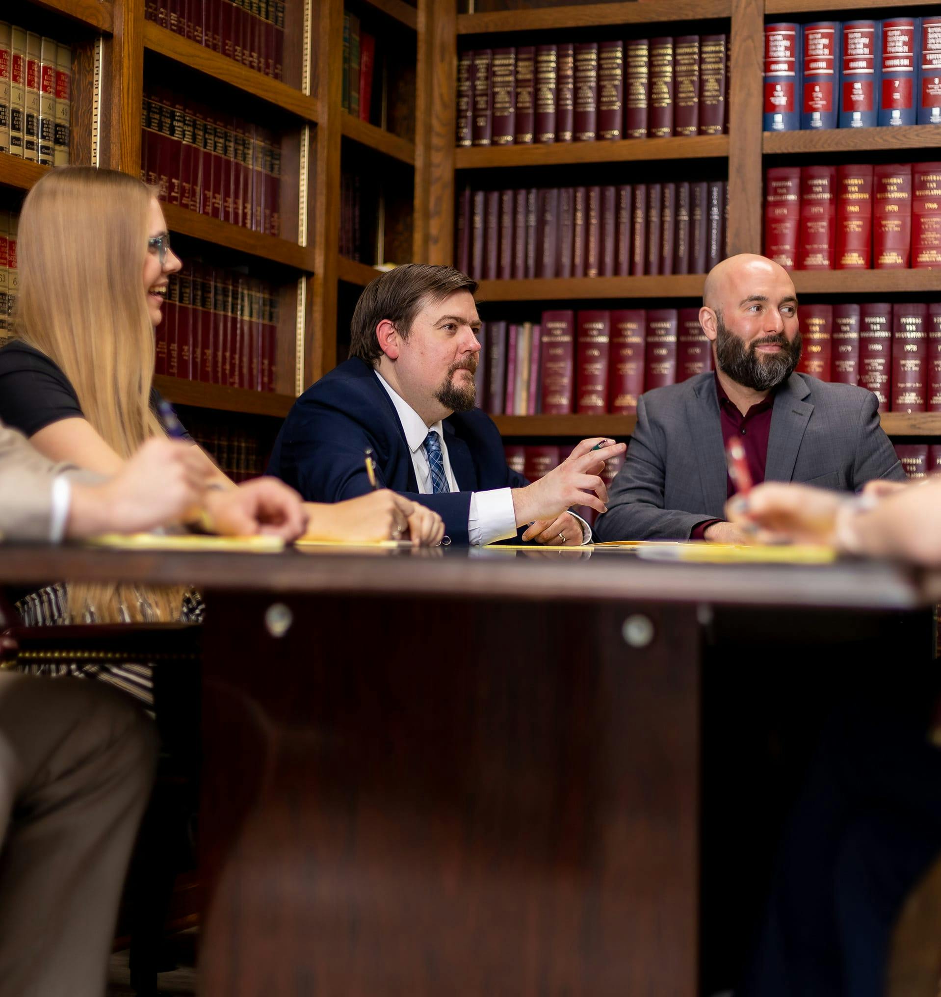 The staff at Hanauer Law in a meeting.