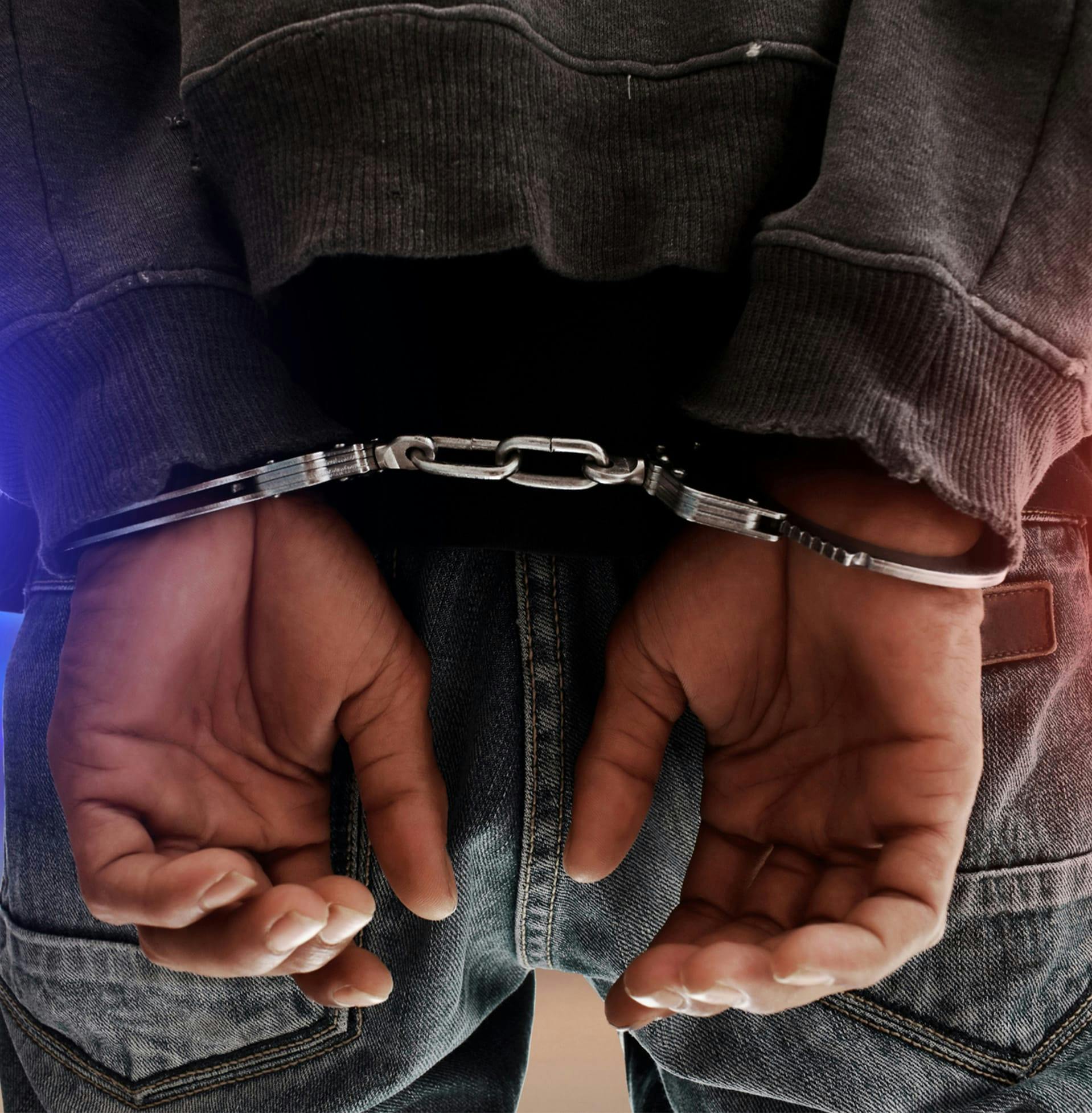 Closeup of hands in handcuffs