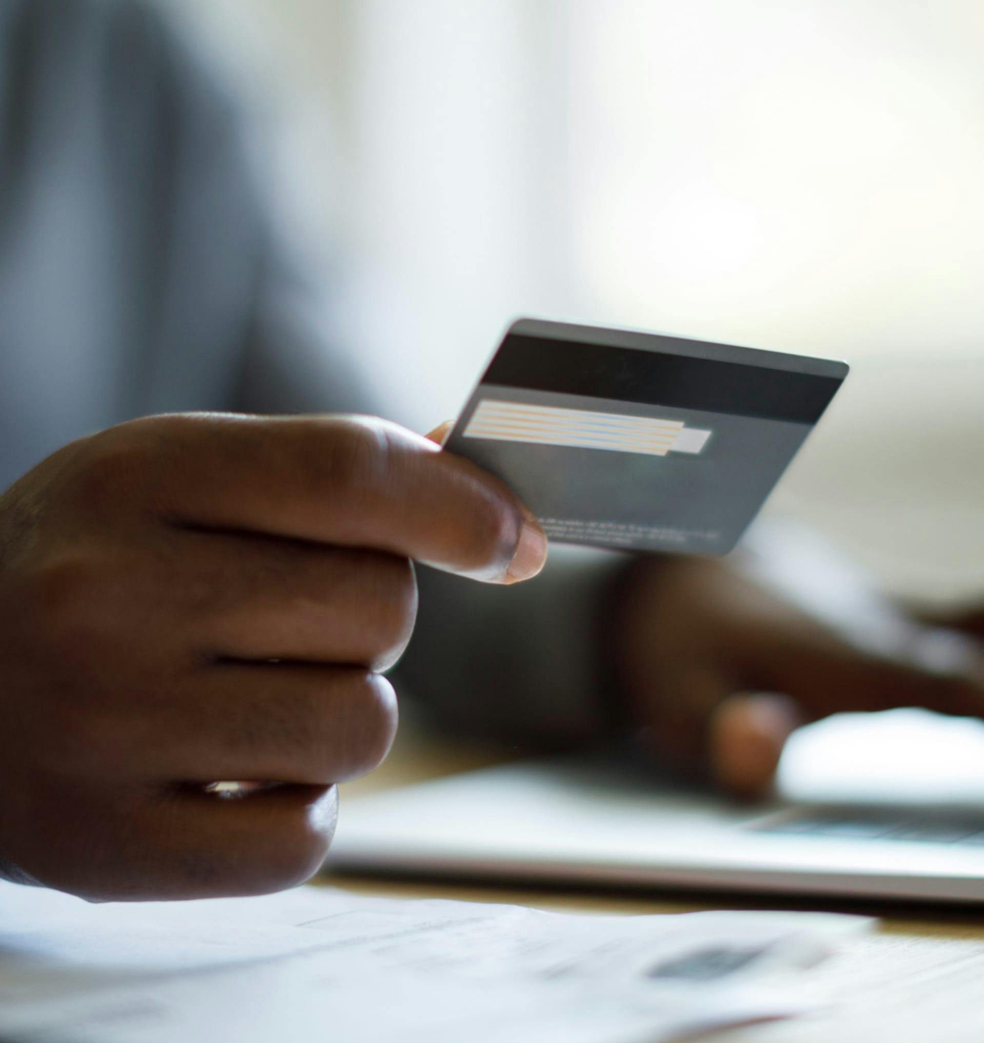 Personl reading from their credit card.