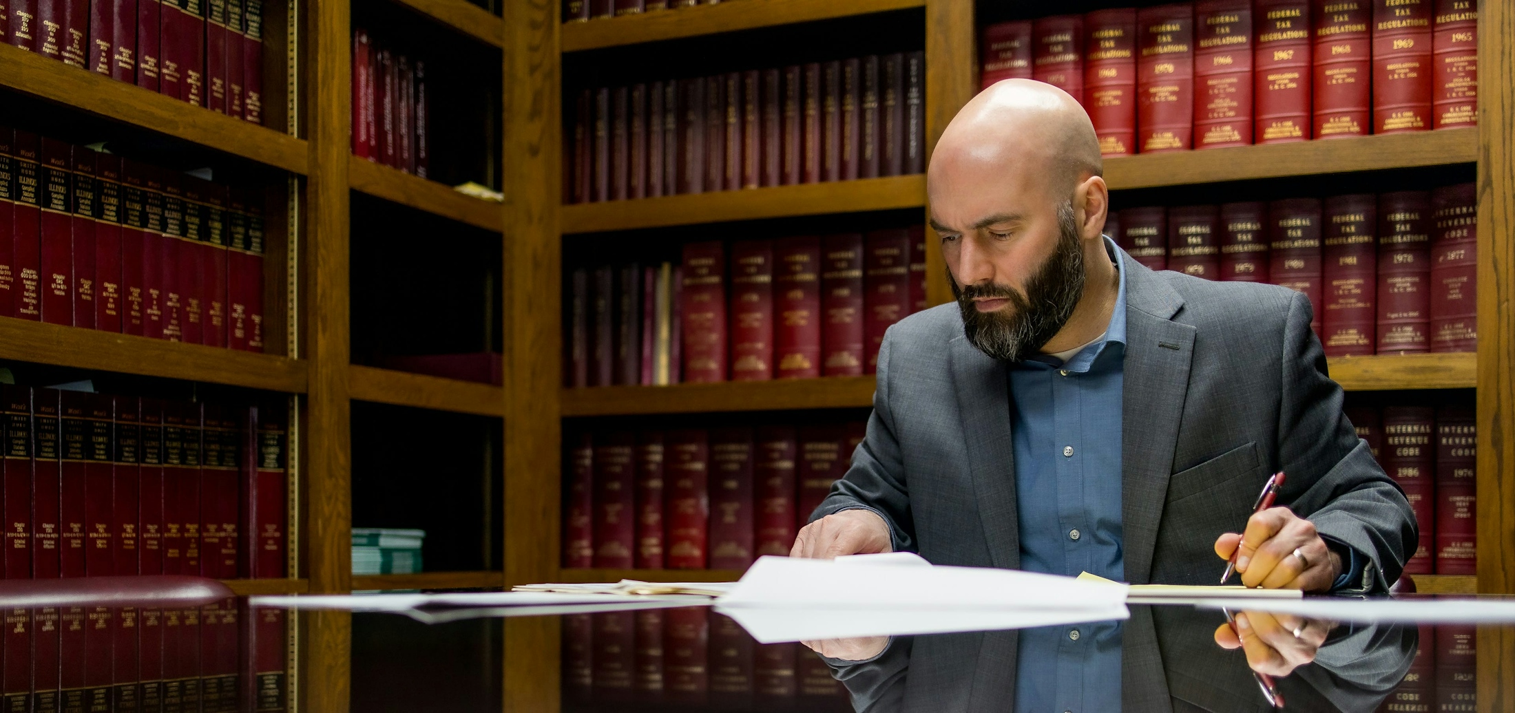 Family Law Banner - Robert J. Hanauer Working on a Case in a Law Office