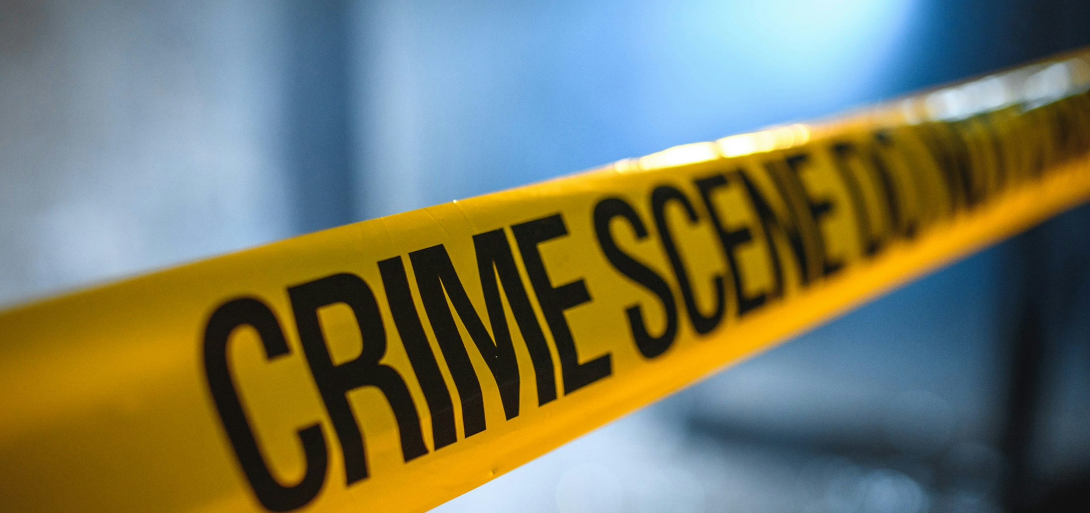 Felony Charges Banner - Yellow Tape with Crime Scene Written on it