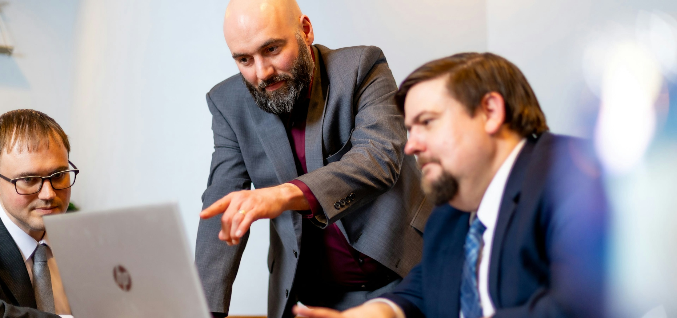 Robert J. Hanauer & Christopher A. Nelson Viewing a Laptop - Parentage And Paternity Banner