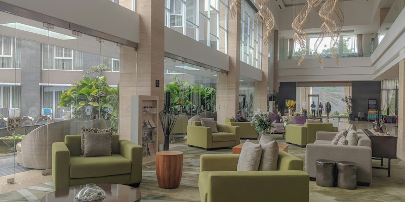 beige sofa set near green potted plant