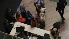 people with luggage on the floor