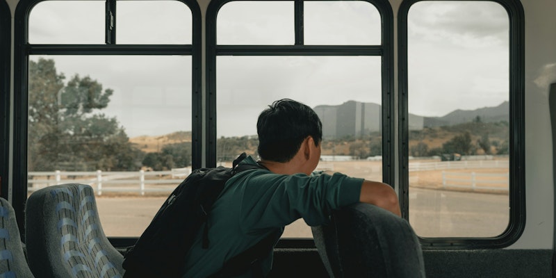 man sitting inside vehicle
