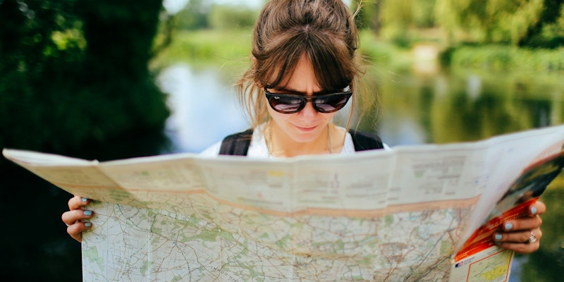 woman in black sunglasses and white shirt