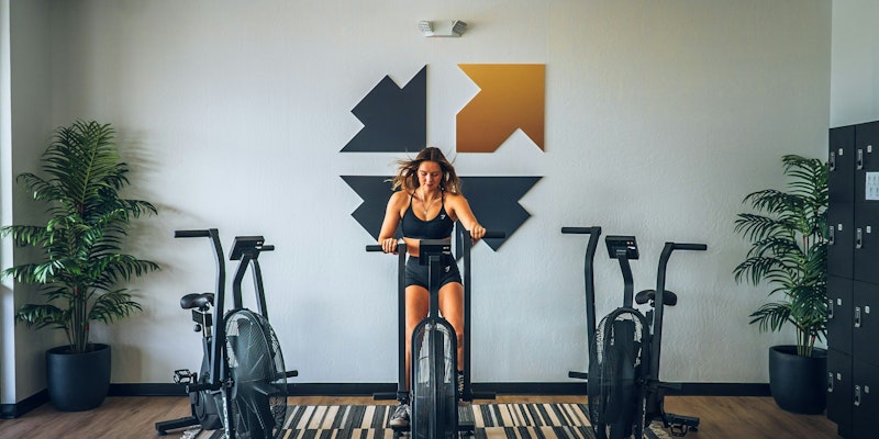 a person standing on a bike