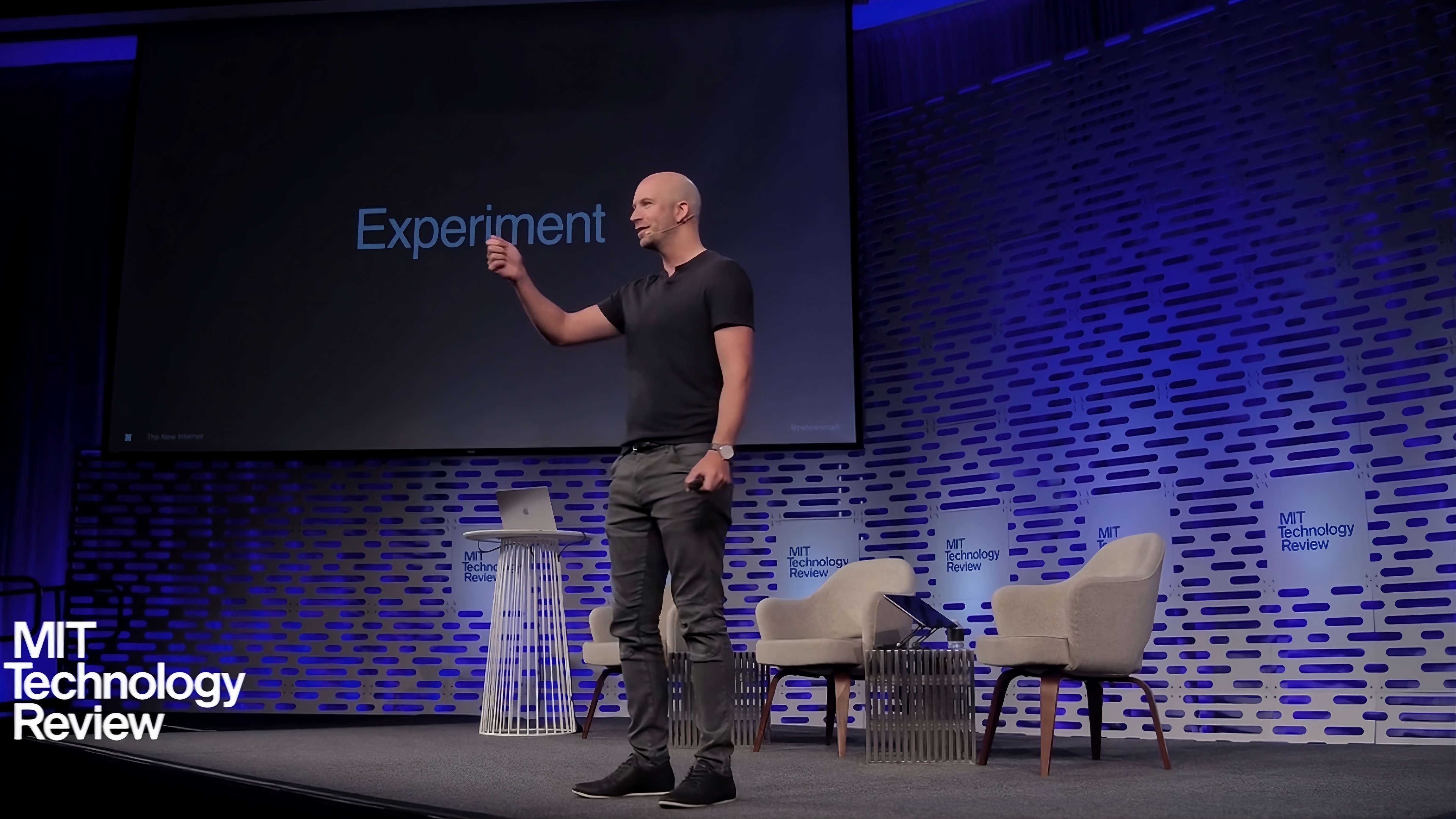 Peter Smart on stage at MIT EmTech AI in Cambridge, introducing agent-to-agent experiences.