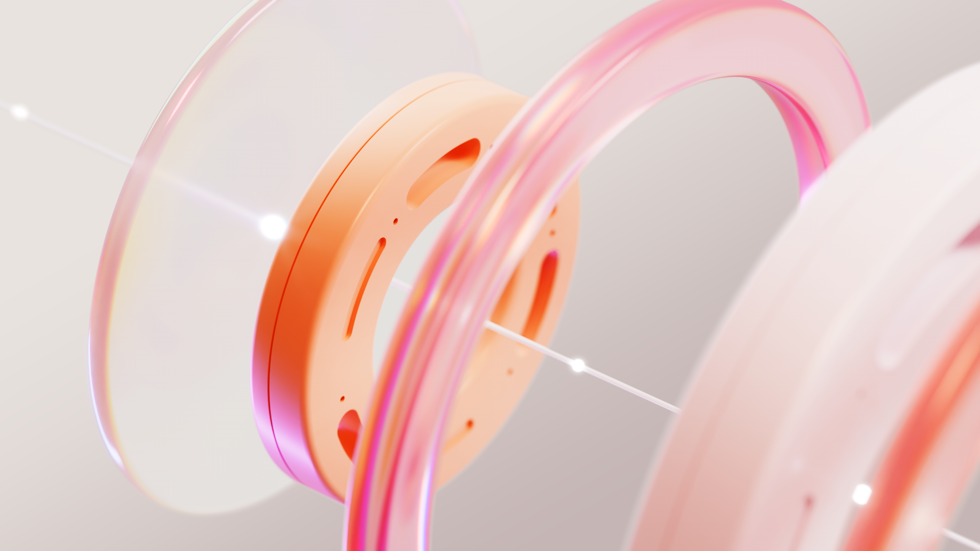 Close-up of an orange disc framed by a clear glass disc and pink glass rings with a line of light running through, illustrating a prototype that stopped being disposable and became the product.