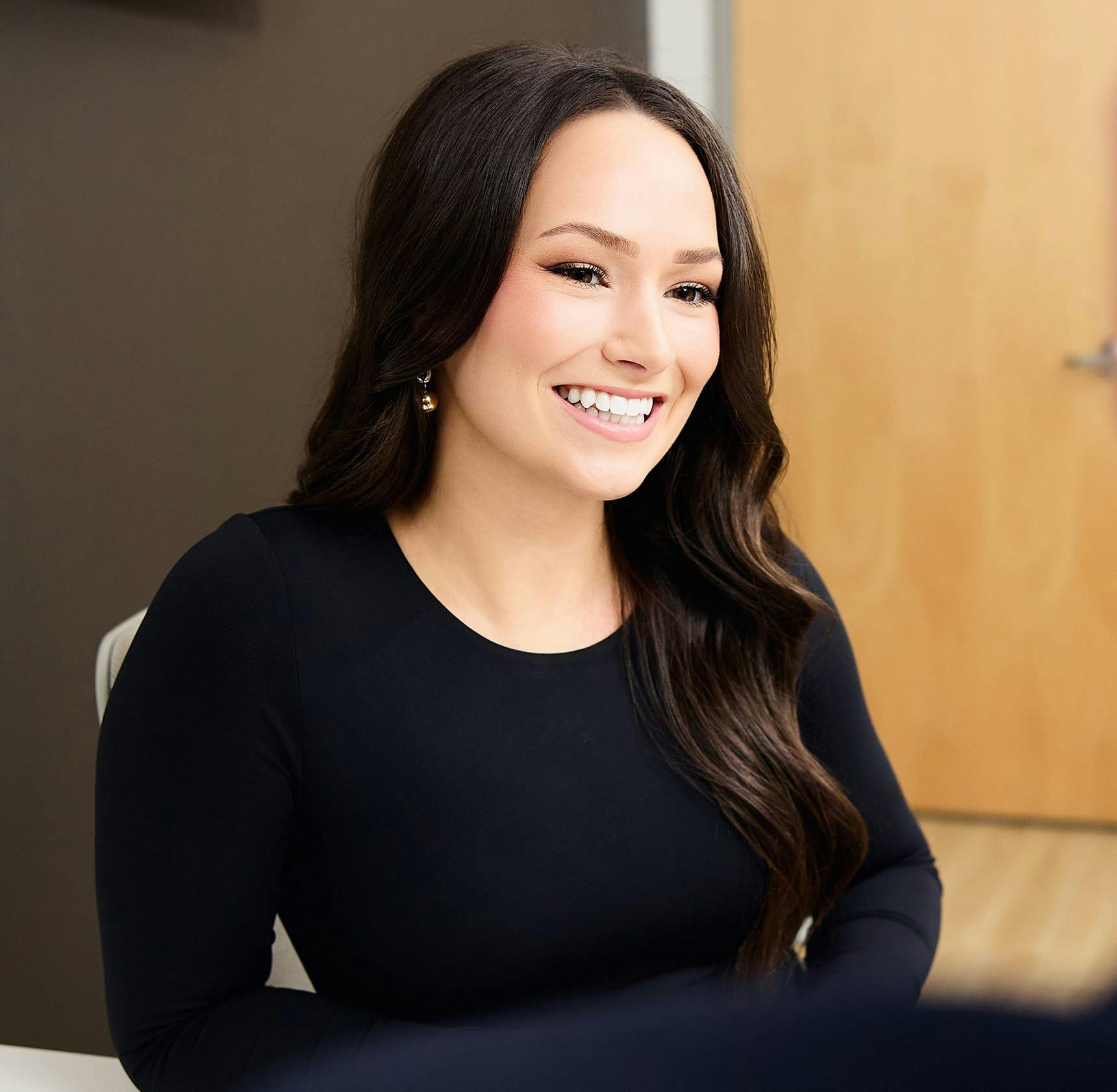 female client sitting and smiling