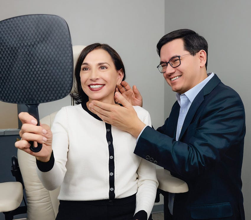 woman looking in the mirror with the doctor