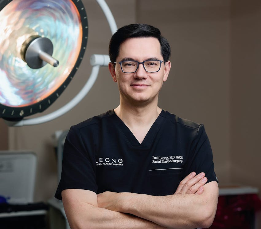 Dr. Leong with his arms crossed