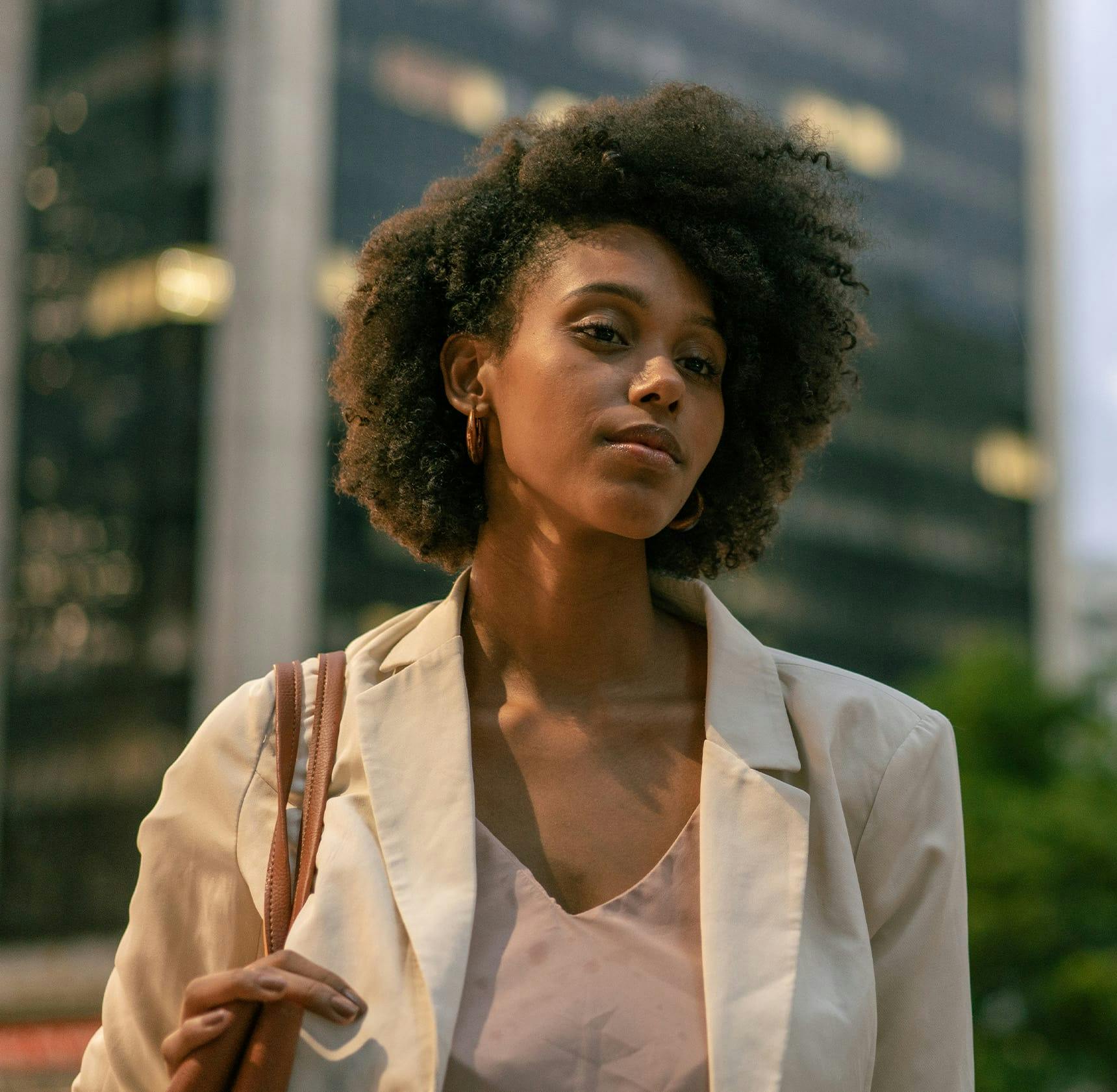 african american woman walking in city