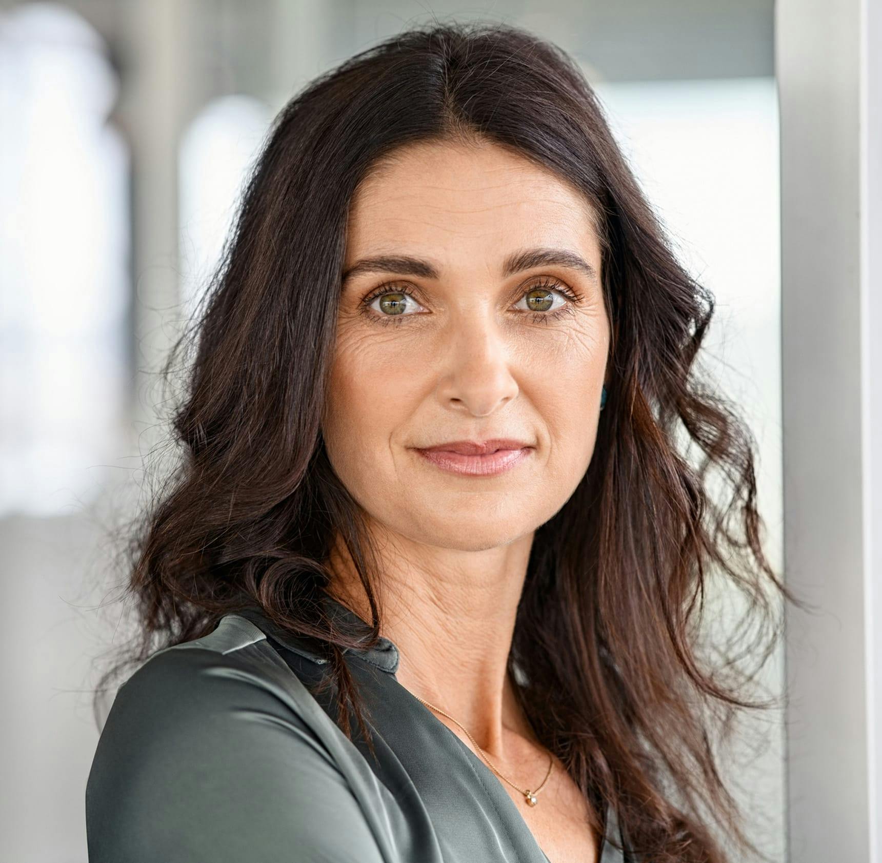 woman looking forward with a straight face