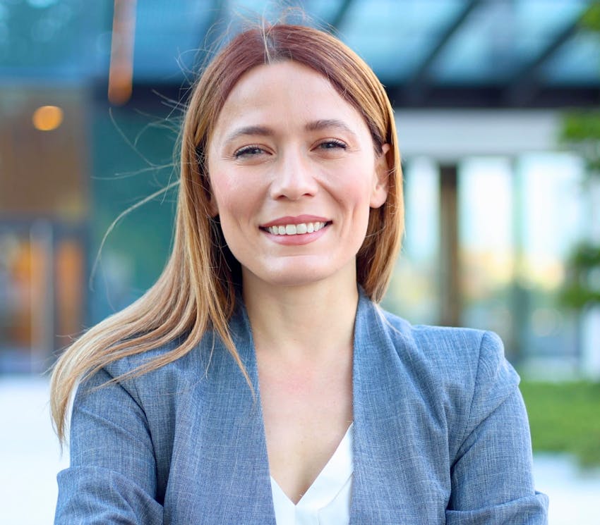 woman smiling in blue jacket