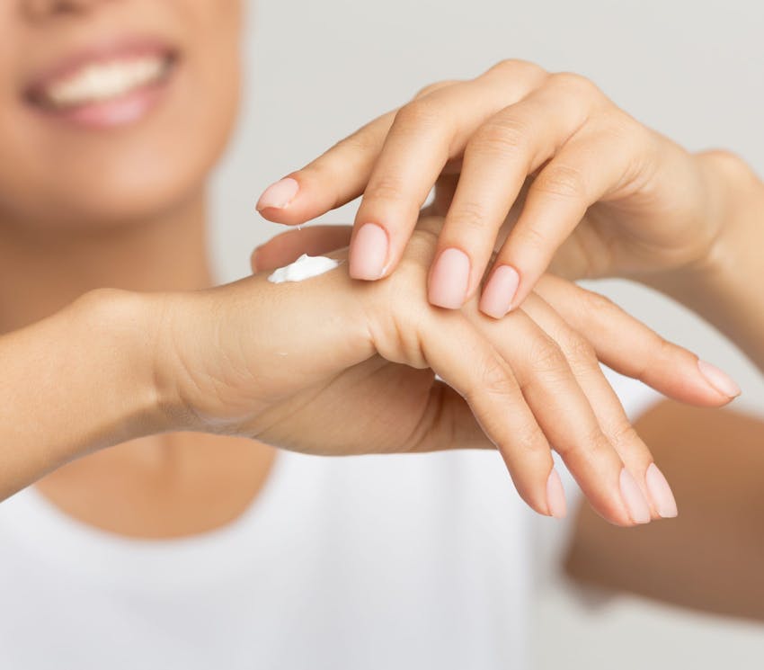 close up on woman's hands on top one another