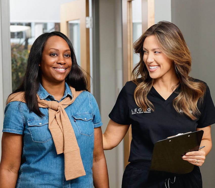 female client walking with receptionist in a hallway