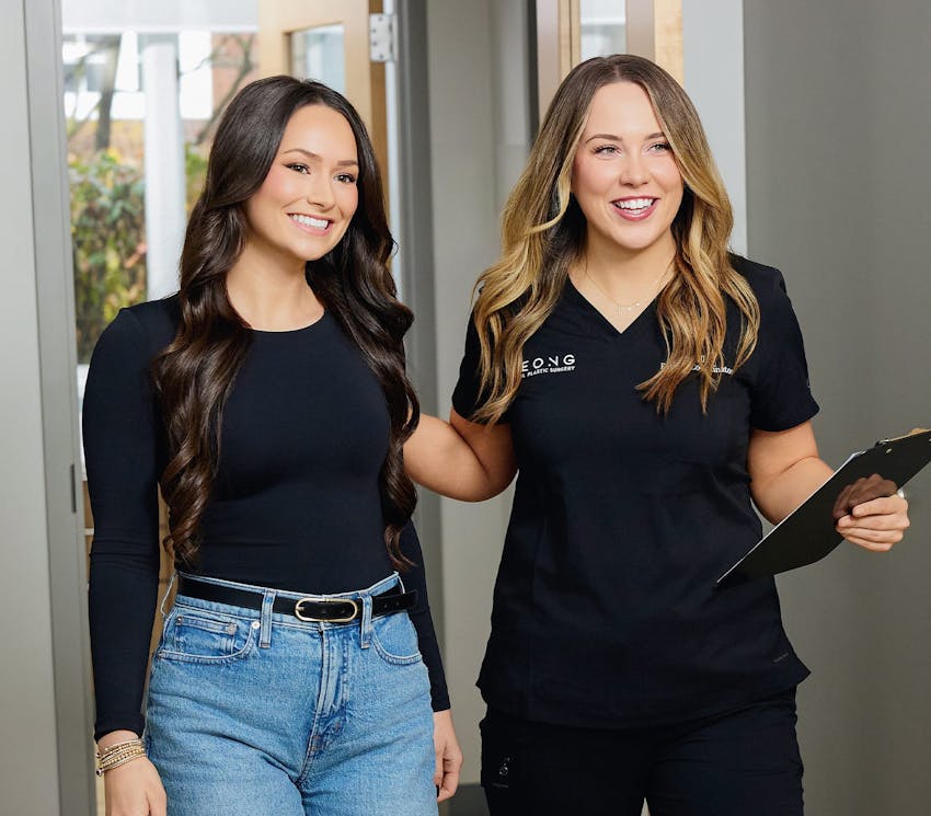 female client walking with recepionist