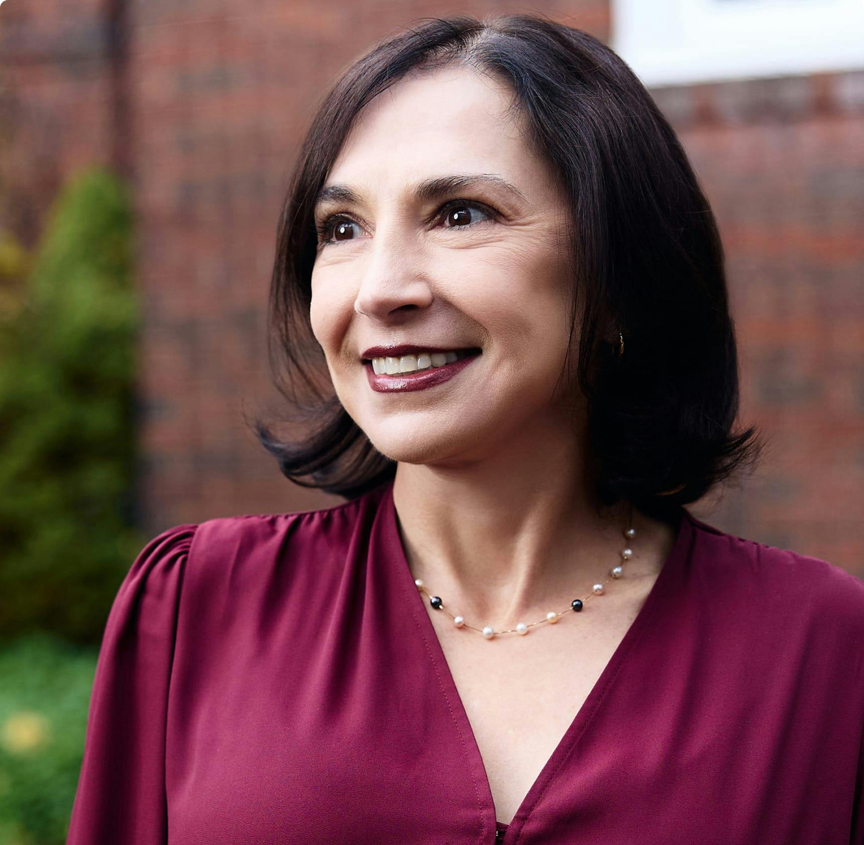 Woman in a burgundy top