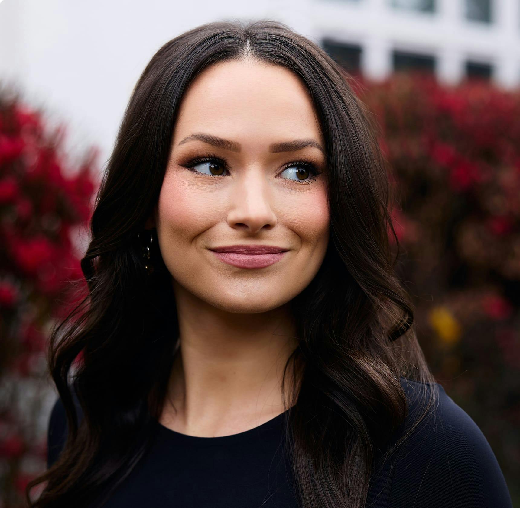 Woman looking to the side and smiling