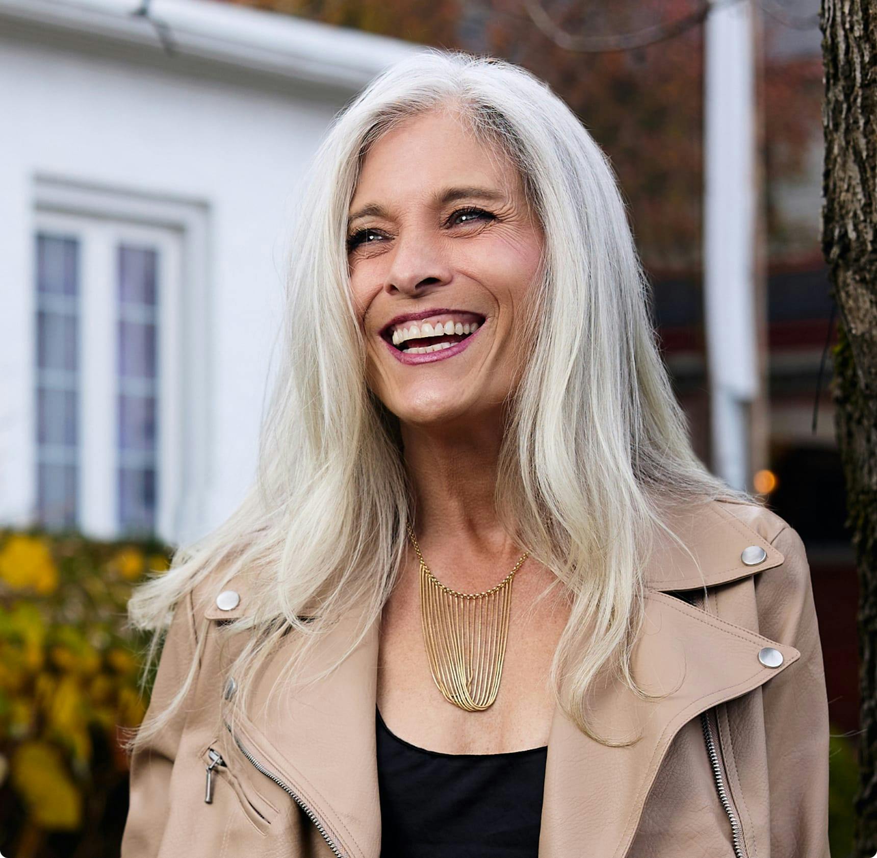 Woman with gray hair, smiling