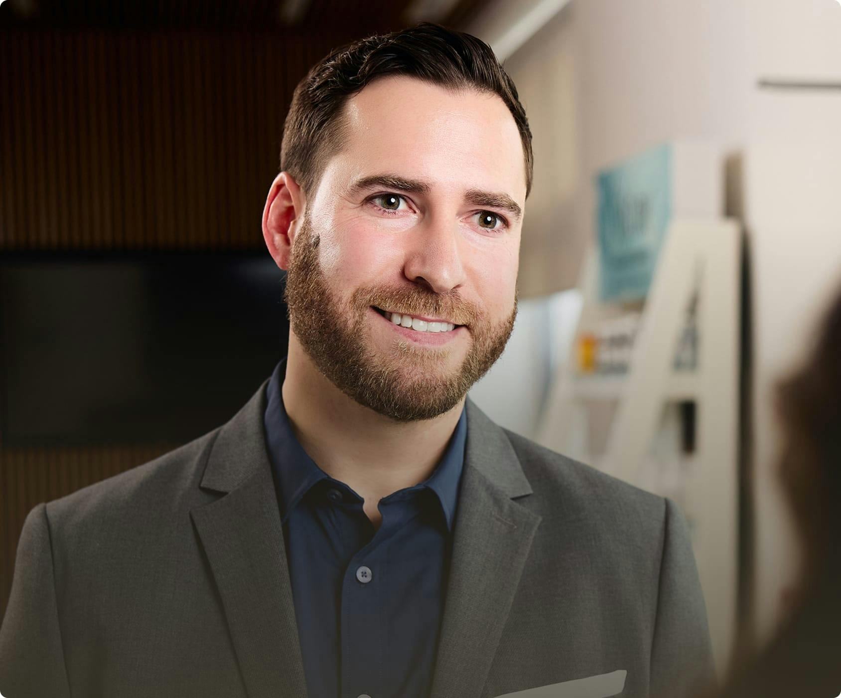 Man in a sports coat smiling