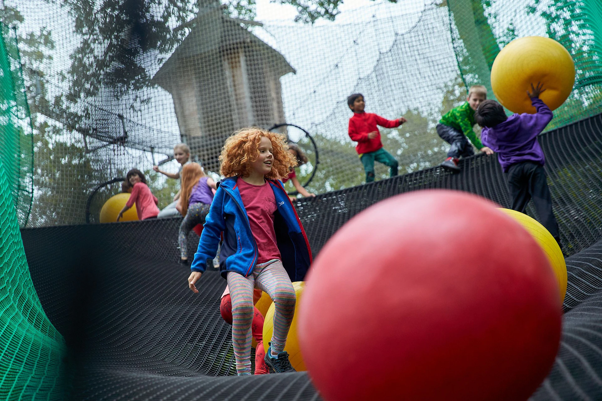 Young people playing on Nets Adventure.