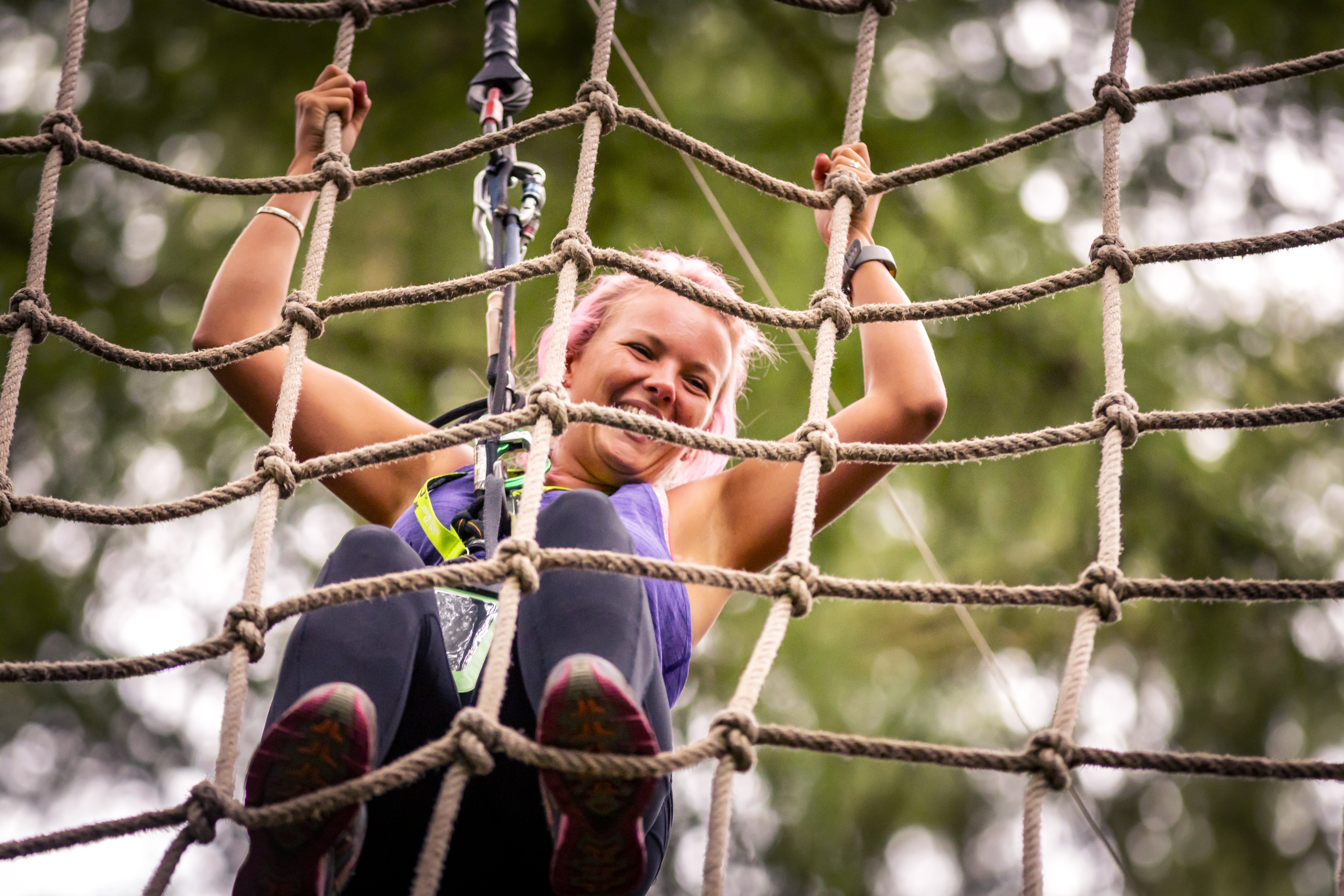 Person climbing a cargo net.