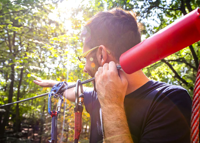 Close up of a person on a high ropes course.
