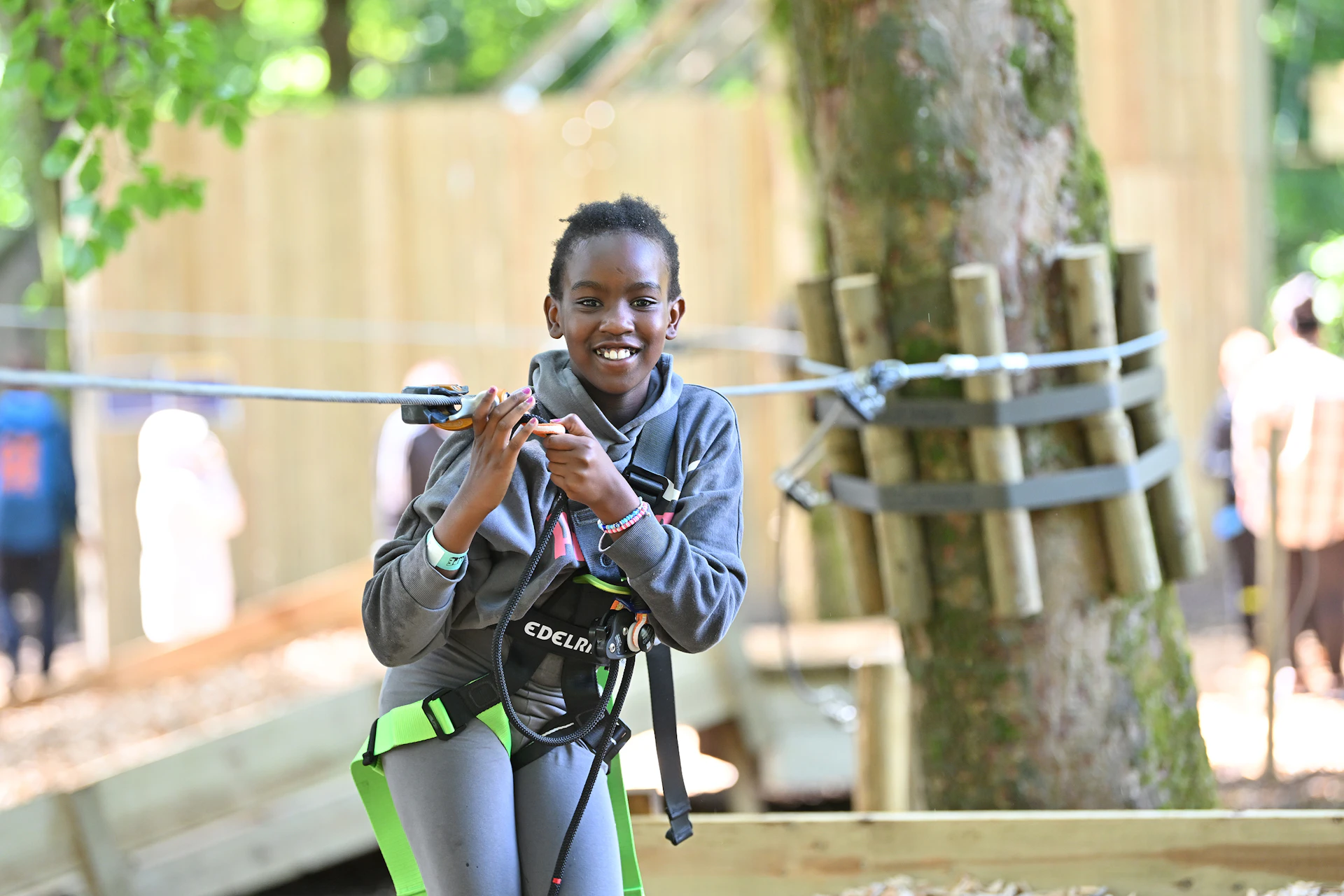 Young person on a high ropes course.