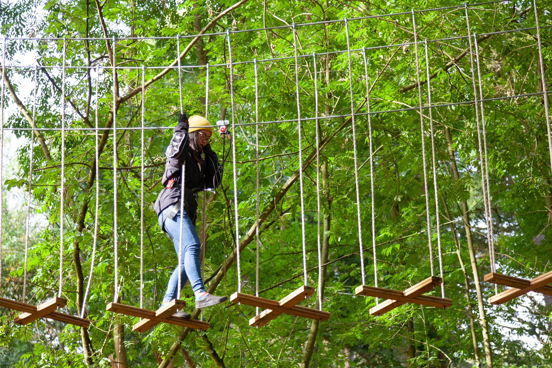 Person on a high ropes course.