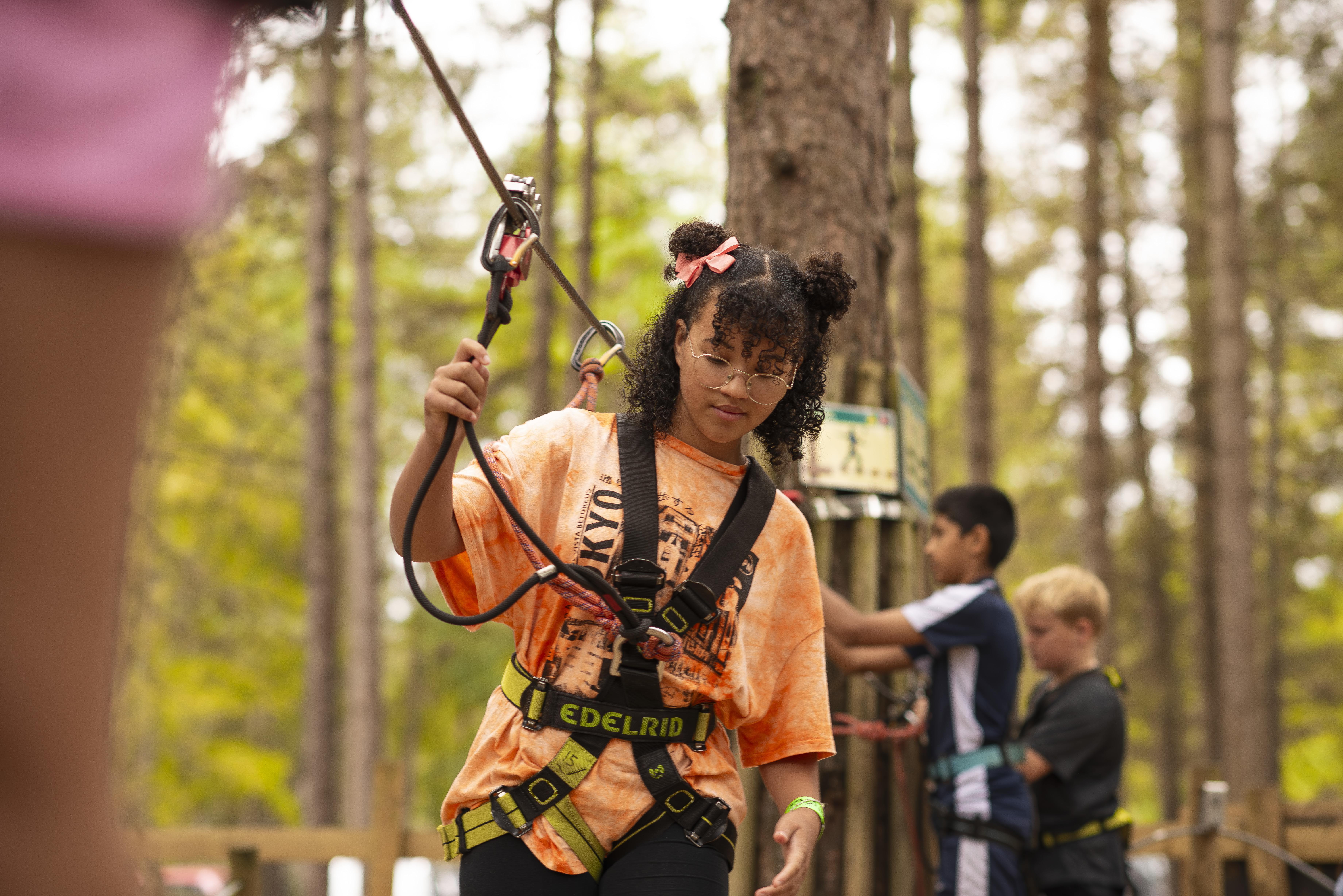 Young people on a high ropes course.