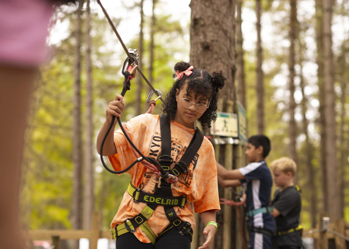 Young people on a high ropes course.