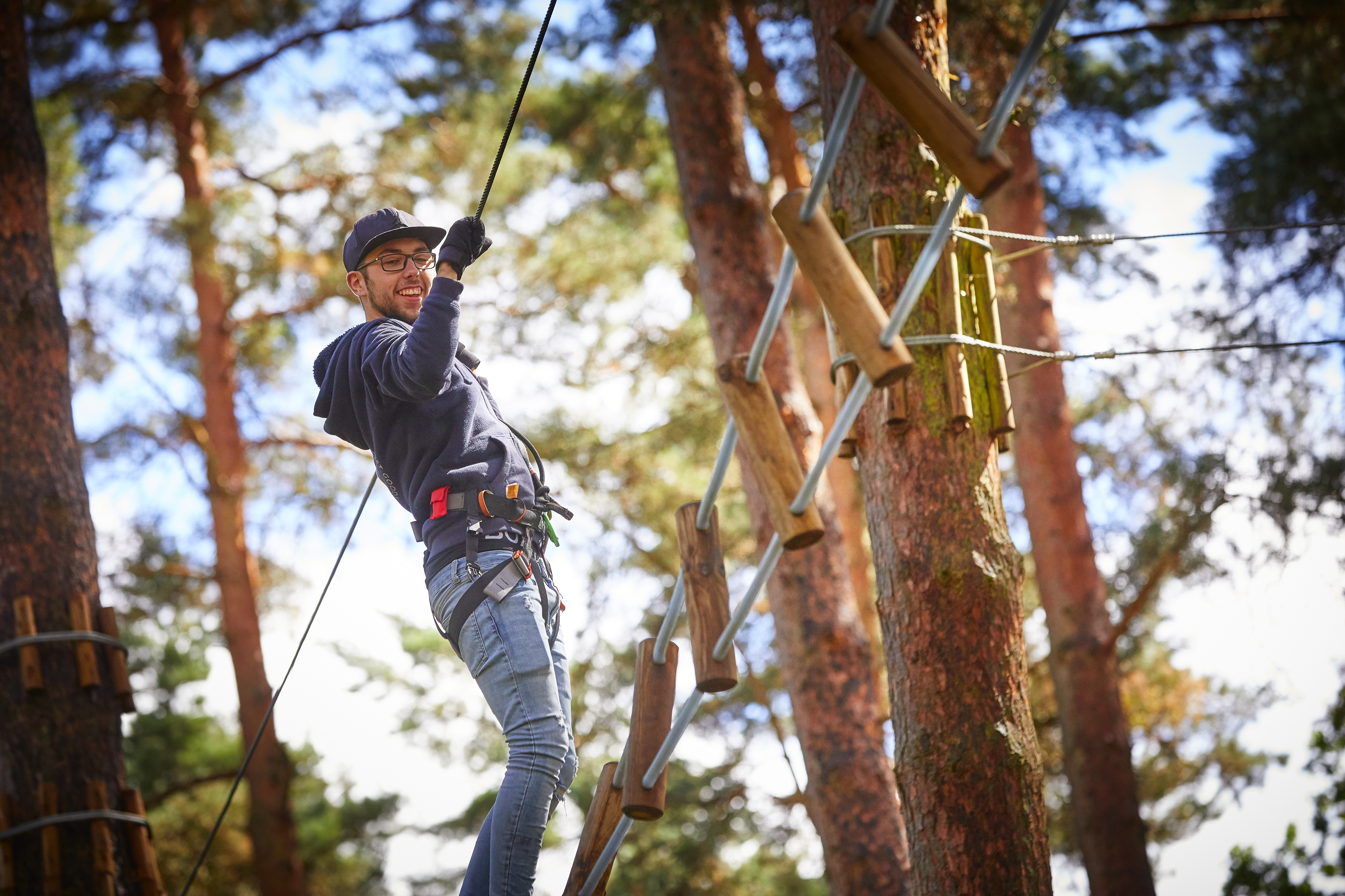 Person on a high ropes course.