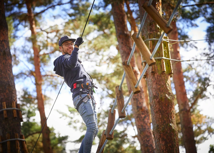 Person on a high ropes course.