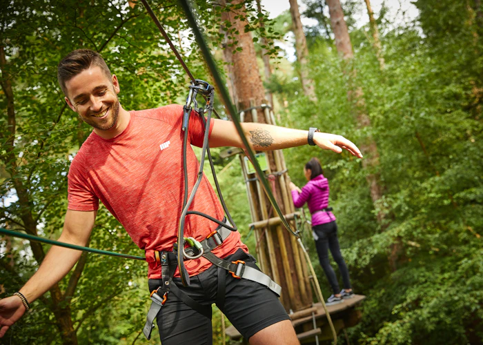 Person on a high ropes course.