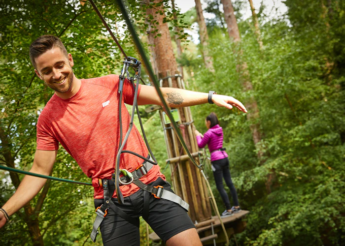 Person on a high ropes course.