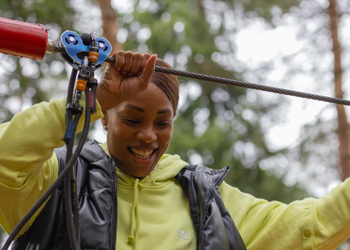 Person on a high ropes course.