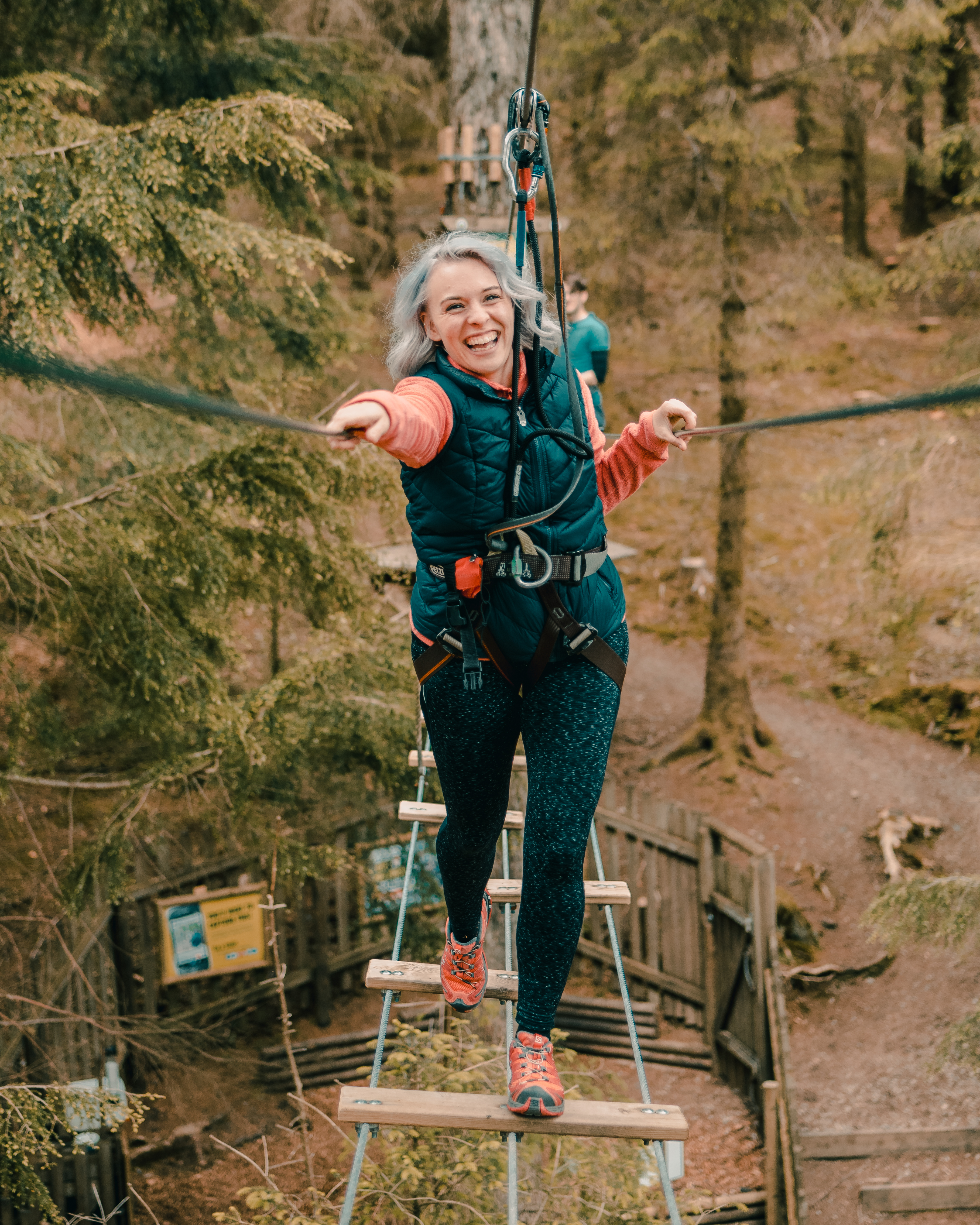 Person on a high ropes course.