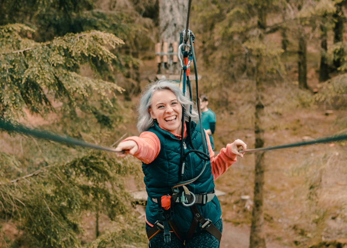 Person on a high ropes course.