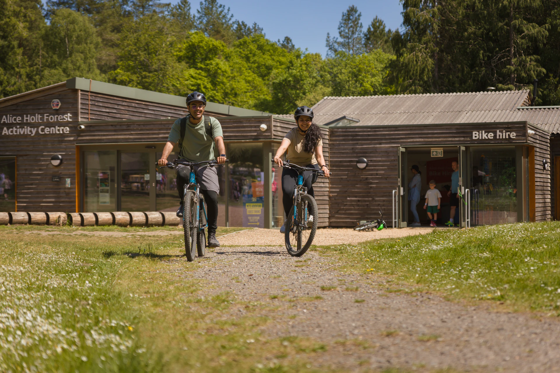 A couple cycle away from the Forest biking cycle hire centre