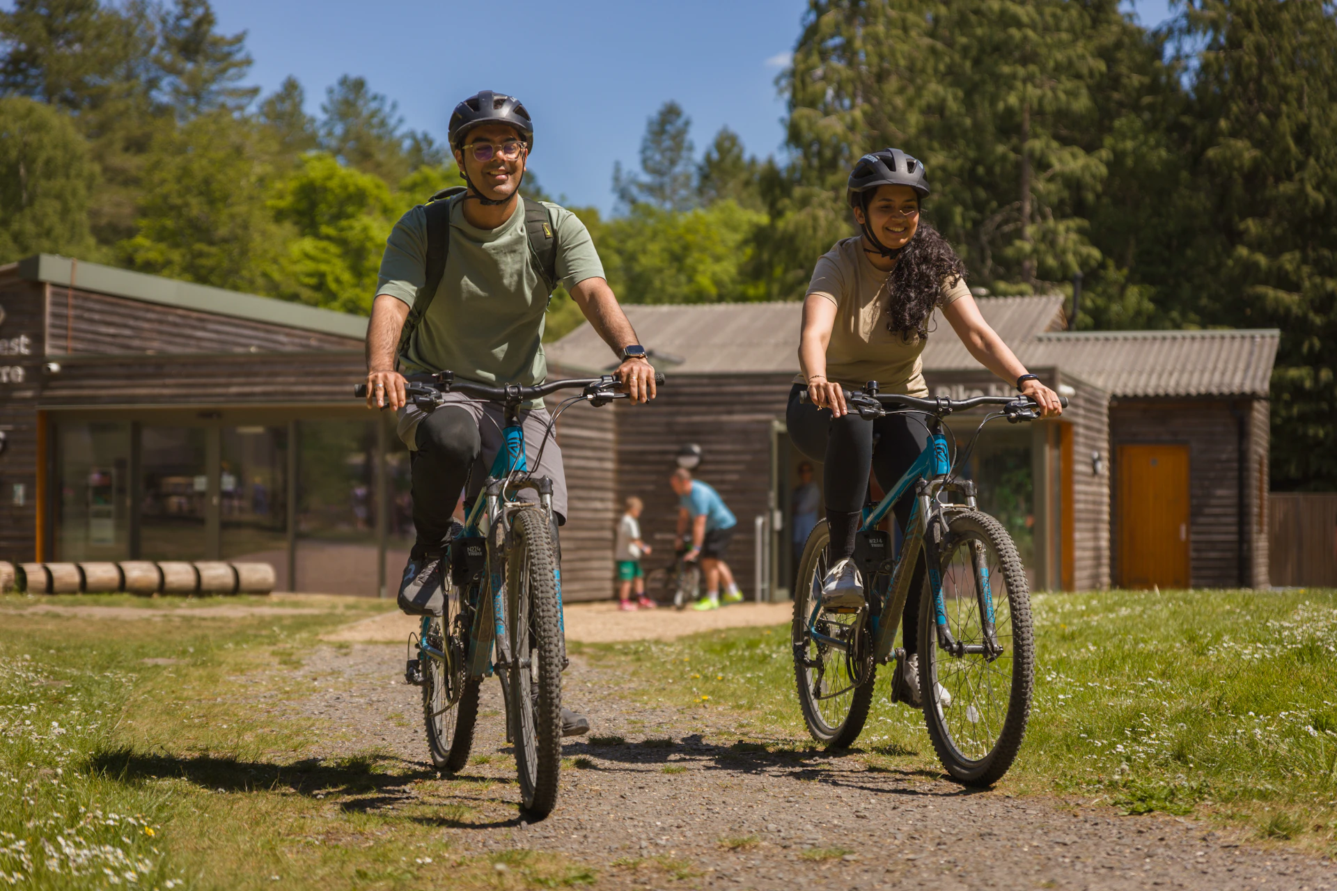 Two people cycling.