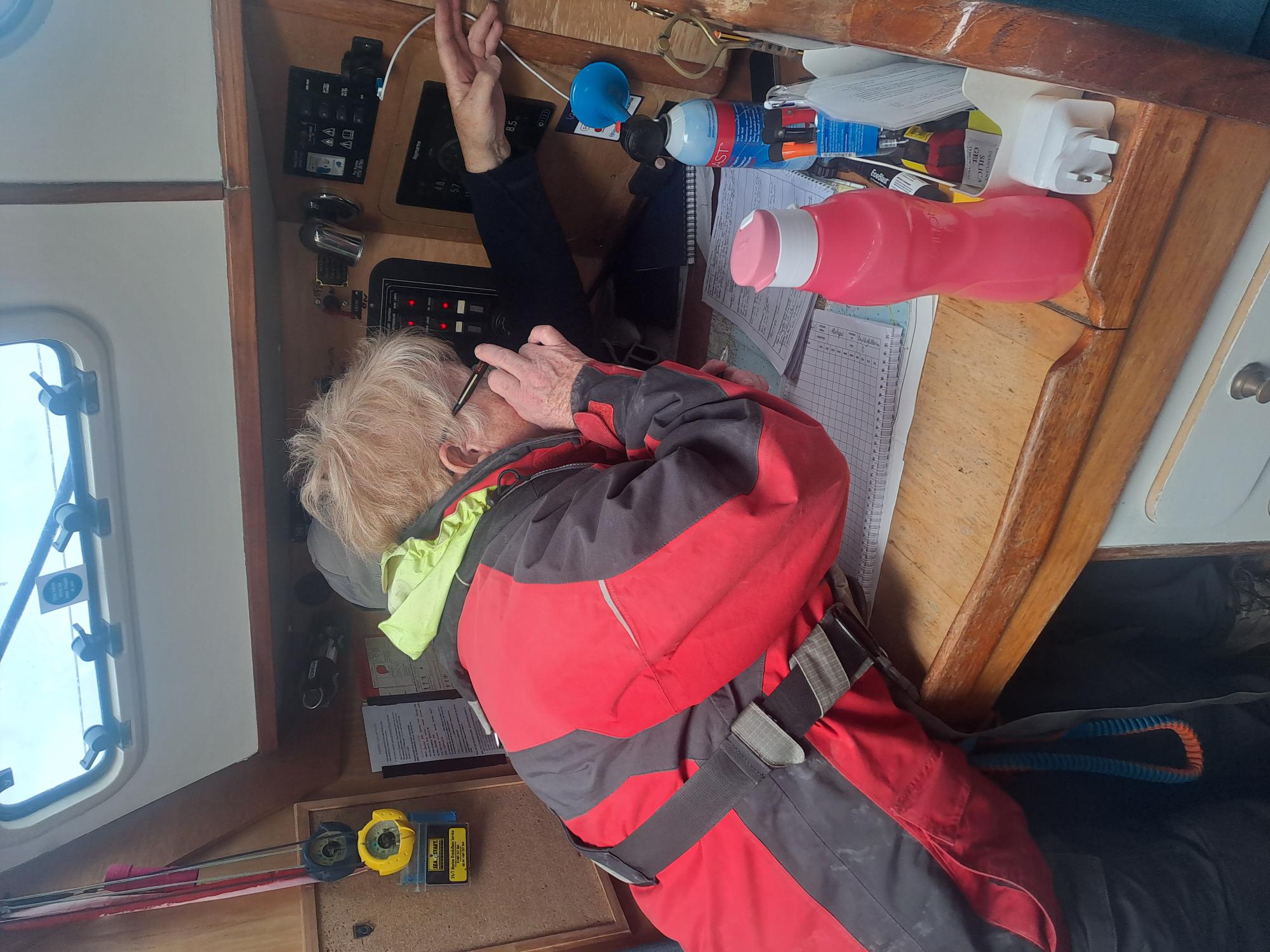 Person using a boat radio.